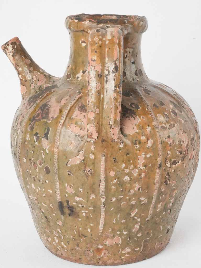 Textured nineteenth-century oil vessel