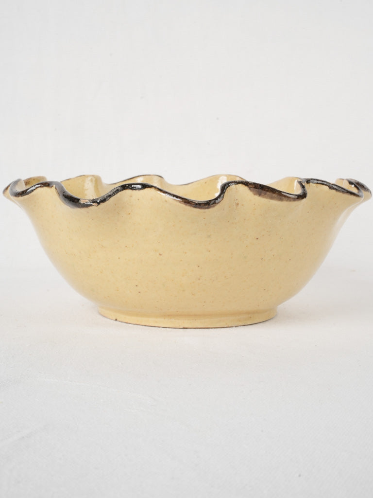 Creamy black-rimmed ceramic bowl