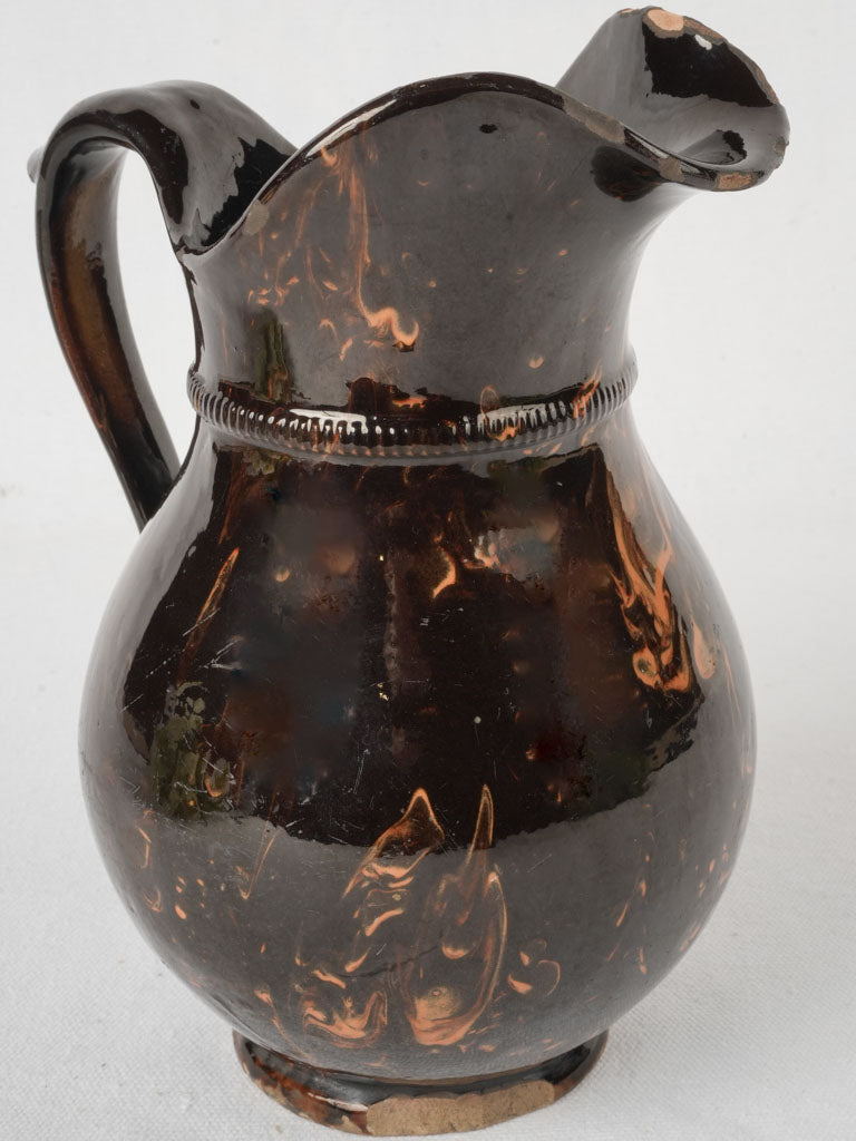 Glossy brown marbled pitcher