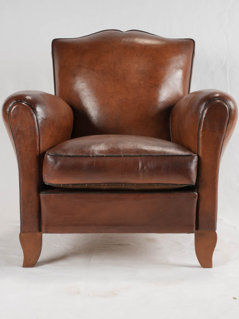 Reserved LM Petite French leather club chair w/ moustache back - 1930s