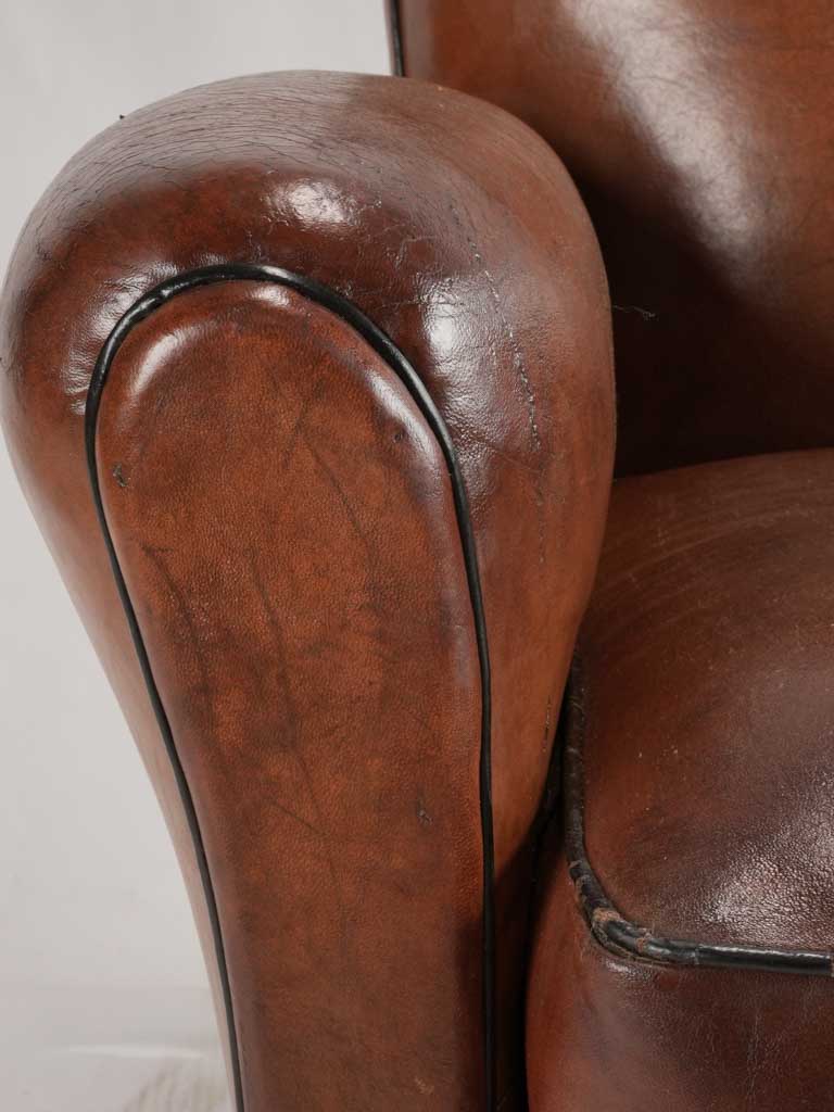 Reserved LM Petite French leather club chair w/ moustache back - 1930s