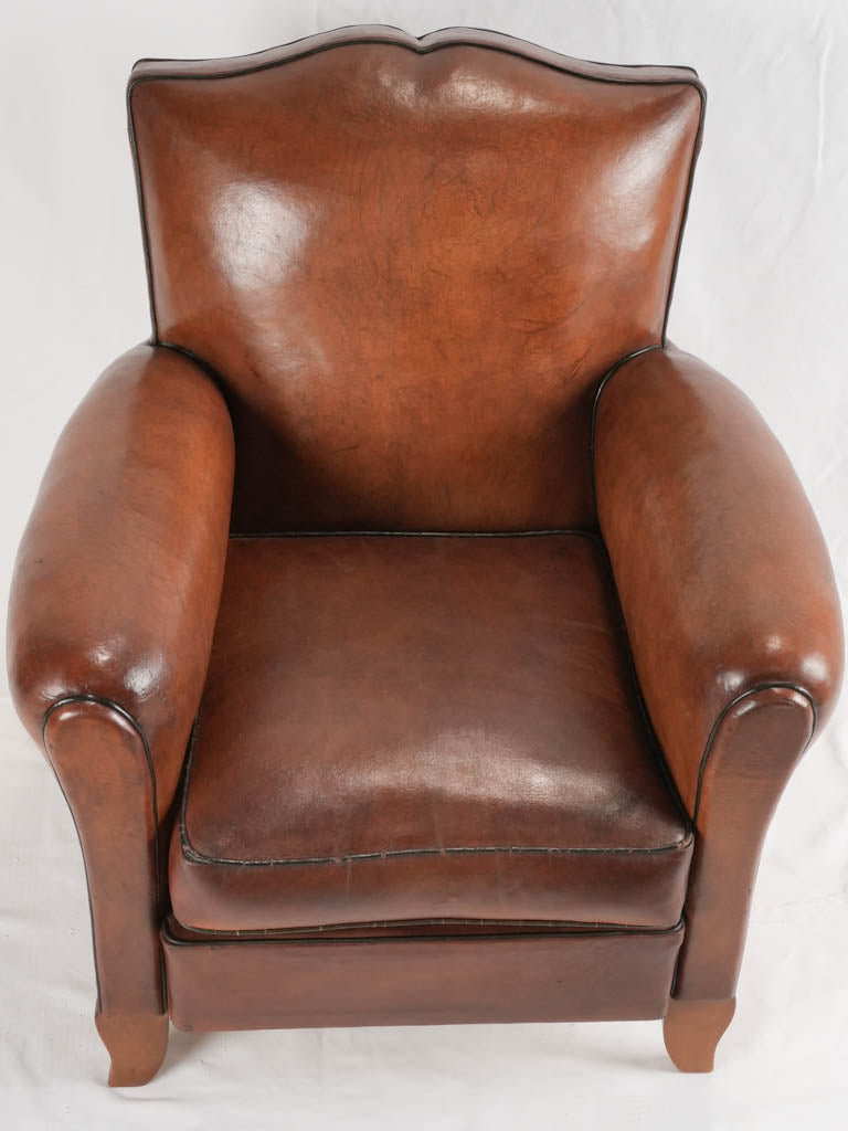 Reserved LM Petite French leather club chair w/ moustache back - 1930s