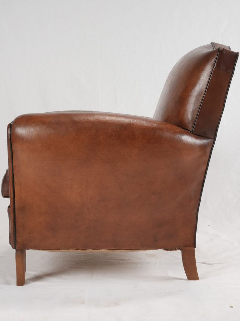 Reserved LM Petite French leather club chair w/ moustache back - 1930s