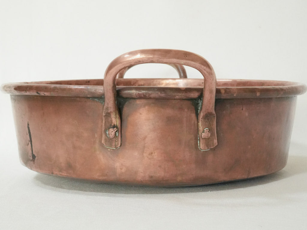 Time-honored double-handled copper pan