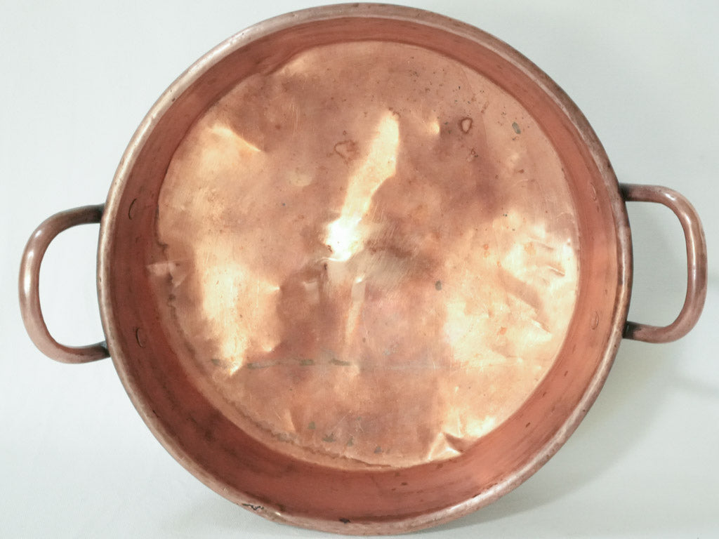 Antique copper pot with handles