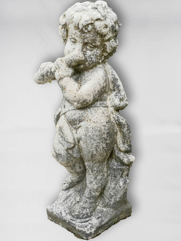 Weathered vintage cherub garden sculpture