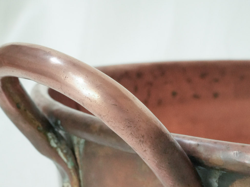 Timeless dual-handled vintage copper pot