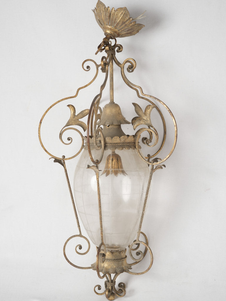 Ornate gilded iron pendant light