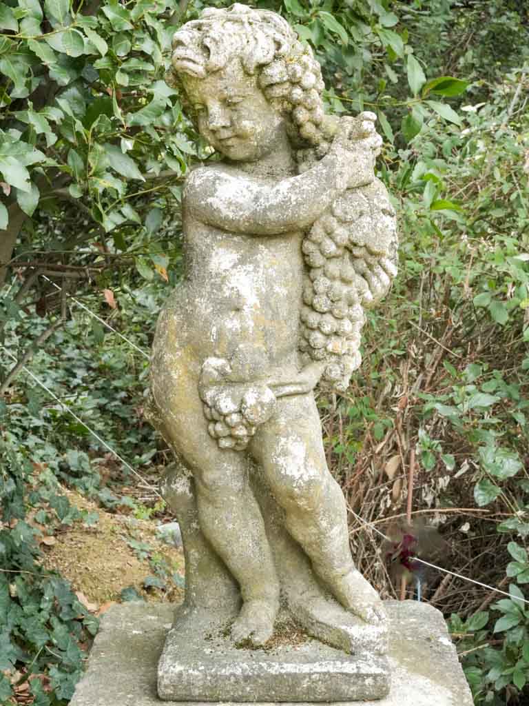 Aged Stone Cherub with Grape Bunches