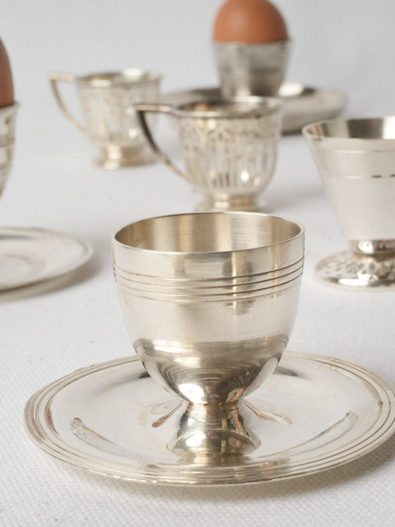 Delicate engraved silver egg cups