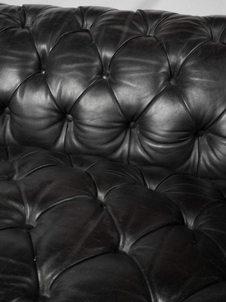 Refined 1960s black leather settee