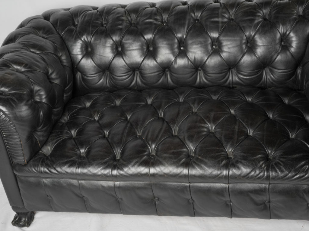 Elegant black Chesterfield settee