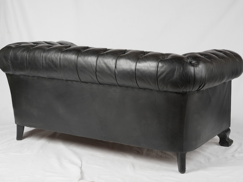 Classic black leather Chesterfield couch