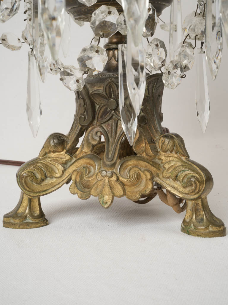 Intricate crystal adorned bronze lamp