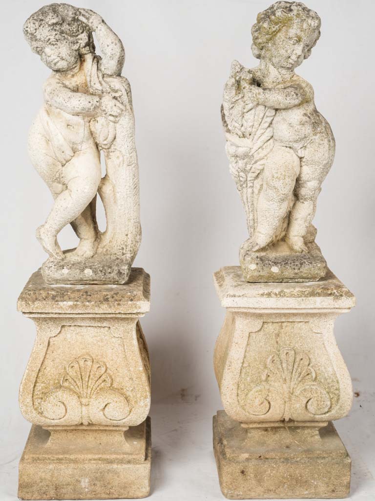 Antique garden cherub stone statues