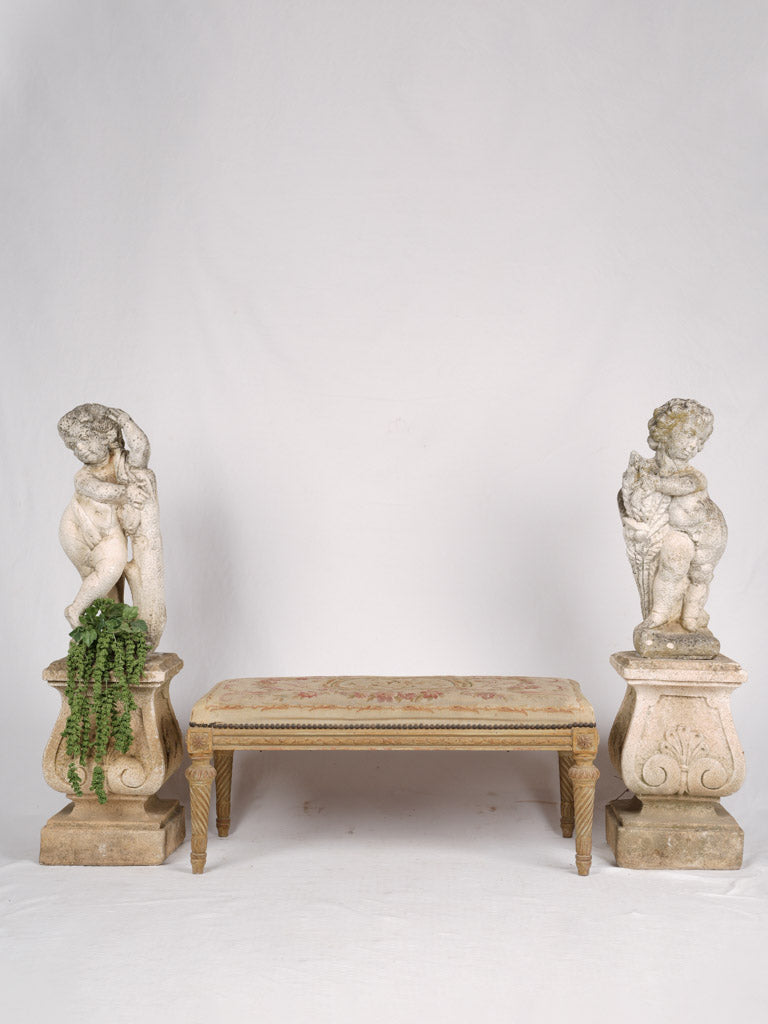 Romantic weathered garden cherub sculptures