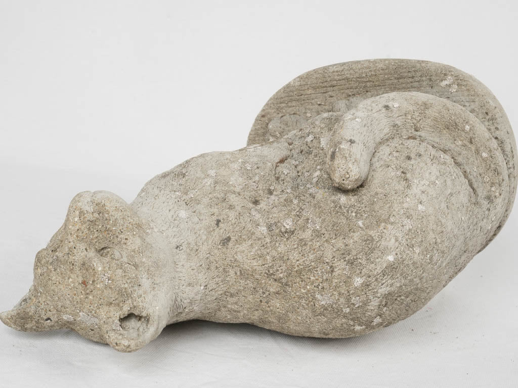 Quaint weathered stone garden cat