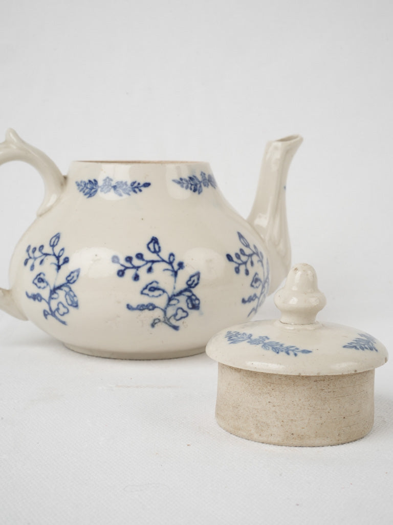 Elegant 19th-century floral earthenware teapot