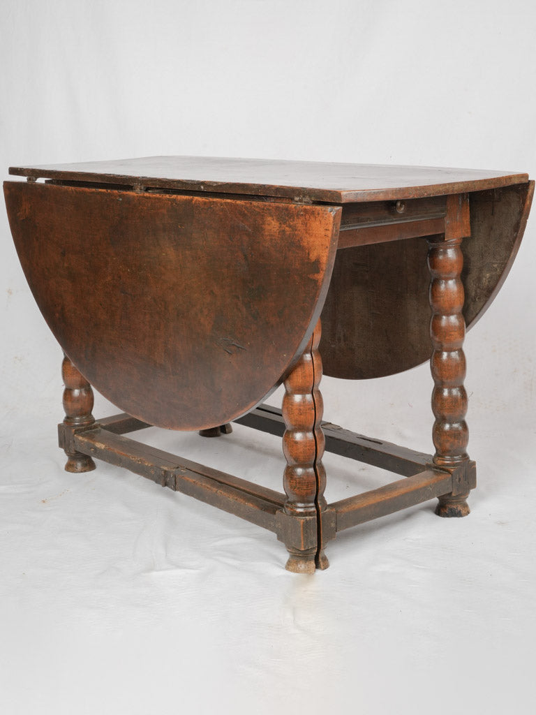 Antique walnut gateleg dining table