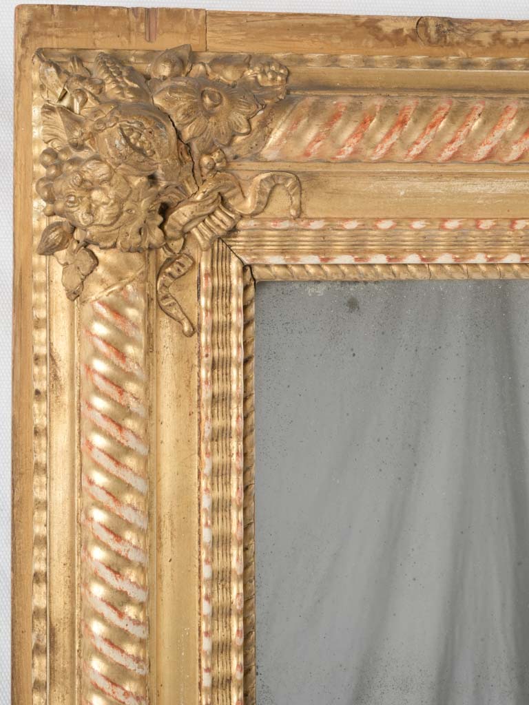 Vintage mercury stucco-framed mirror