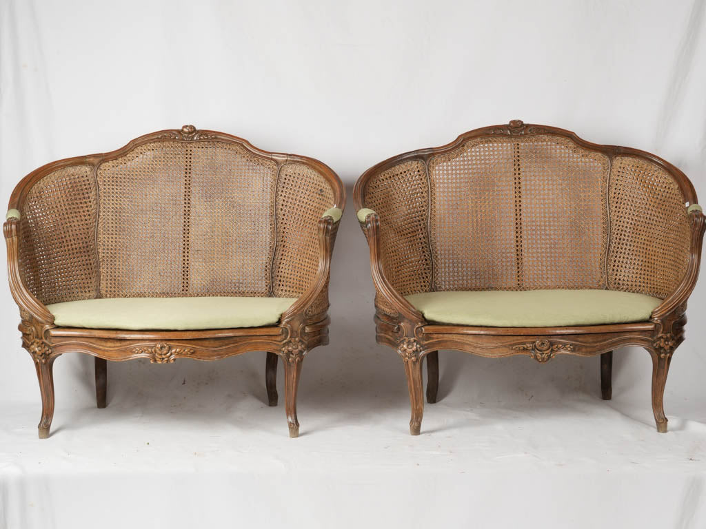 Antique sage green caned settees