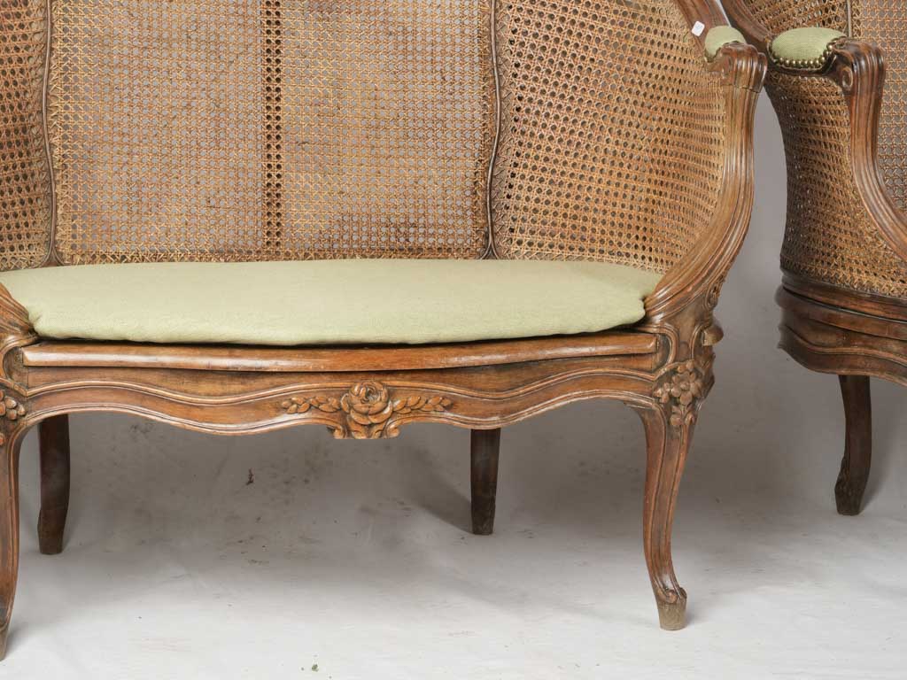 Intricate cane armrest settees