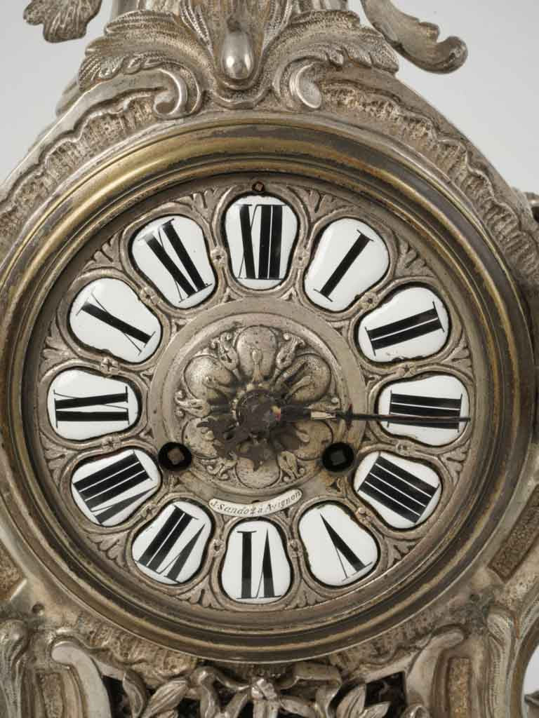 Intricate trophy motif cartel clock