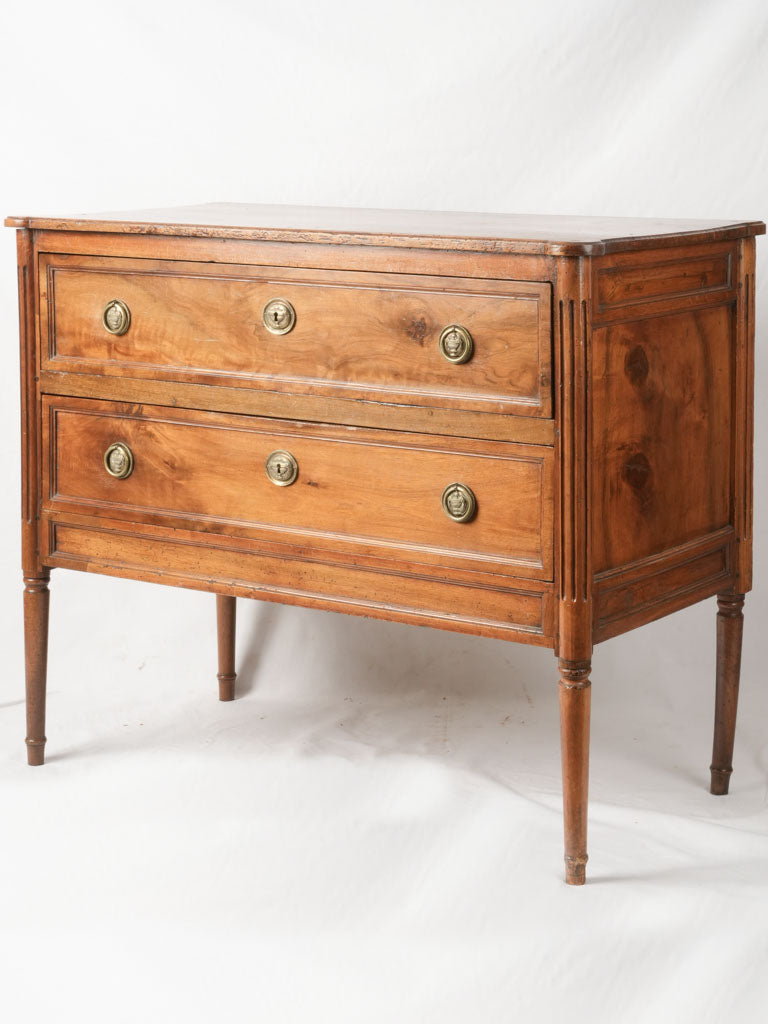 Antique bronze-adorned walnut sauteuse commode