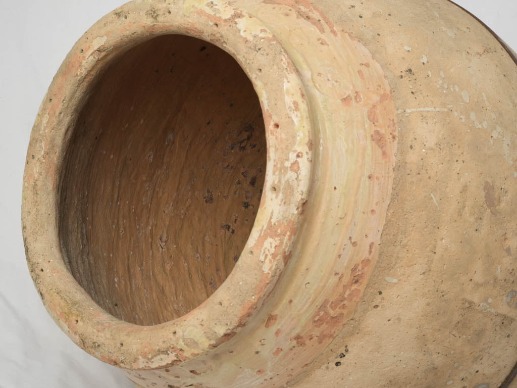 Patina-covered Maltese Cross terracotta jar