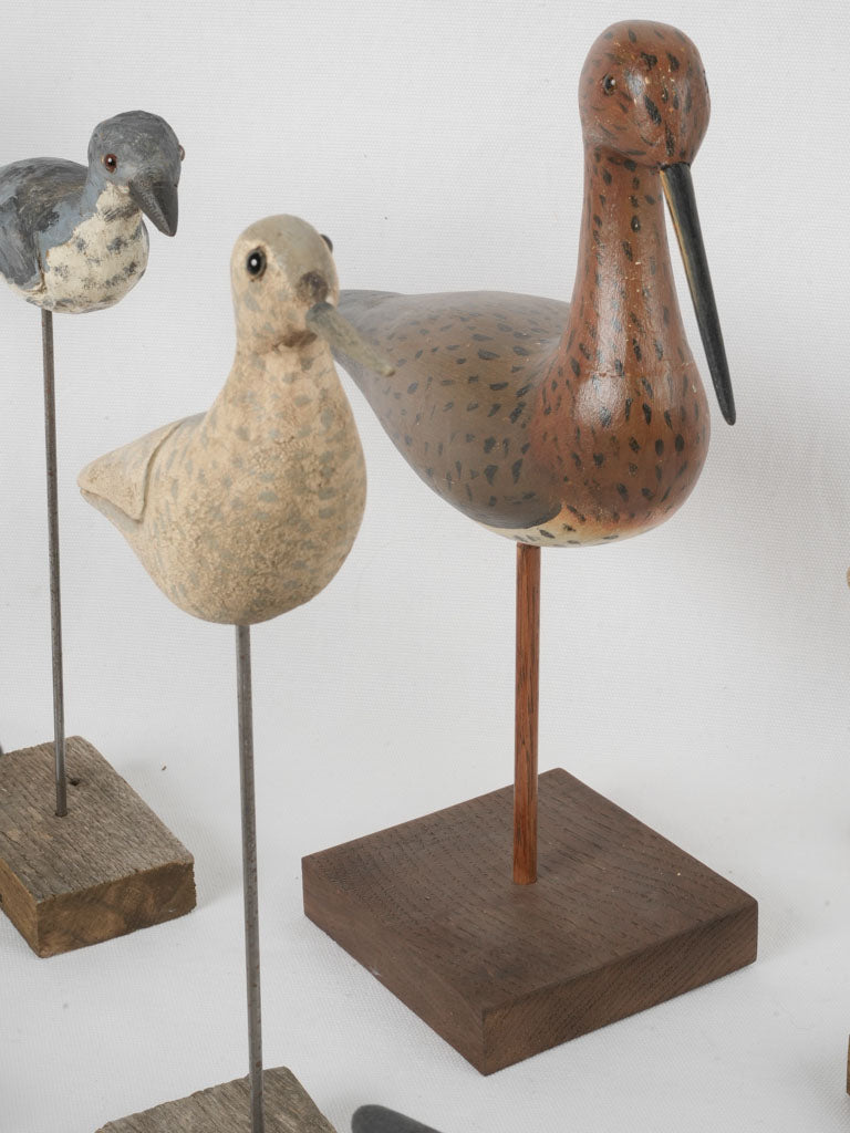 Weathered carved wooden duck statuettes