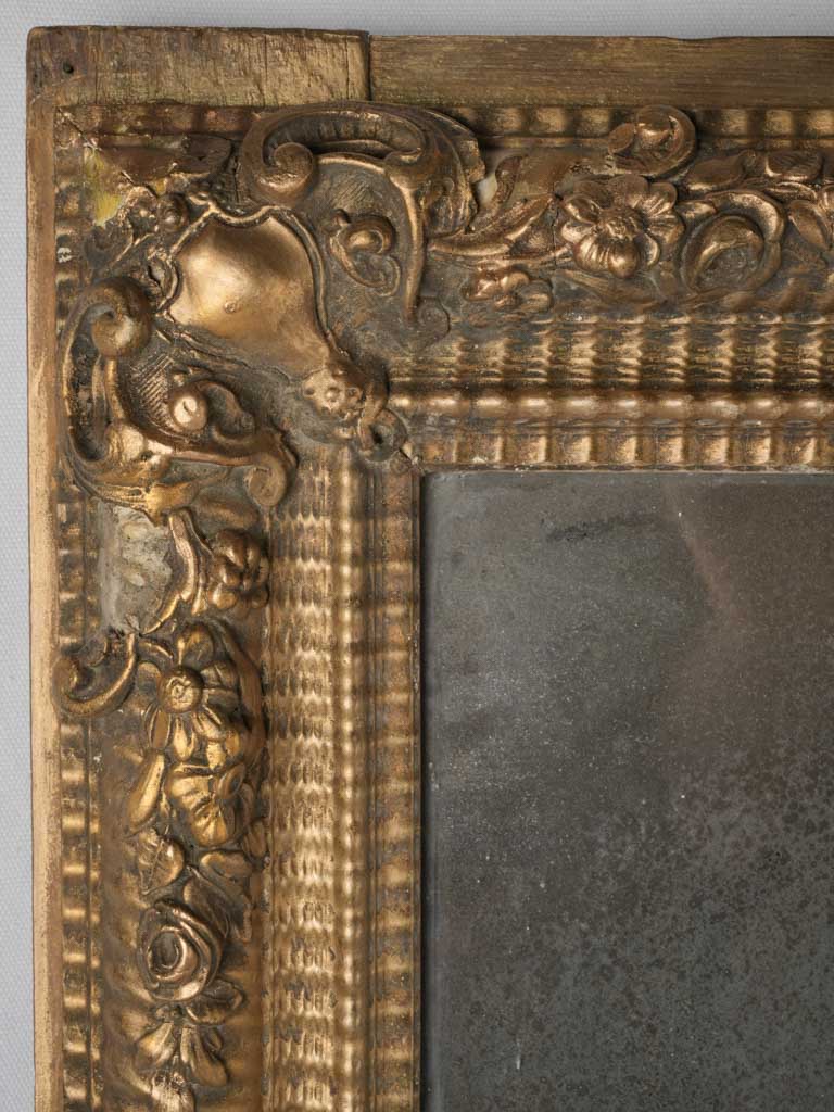 Elegant, aged, wooden wall mirror