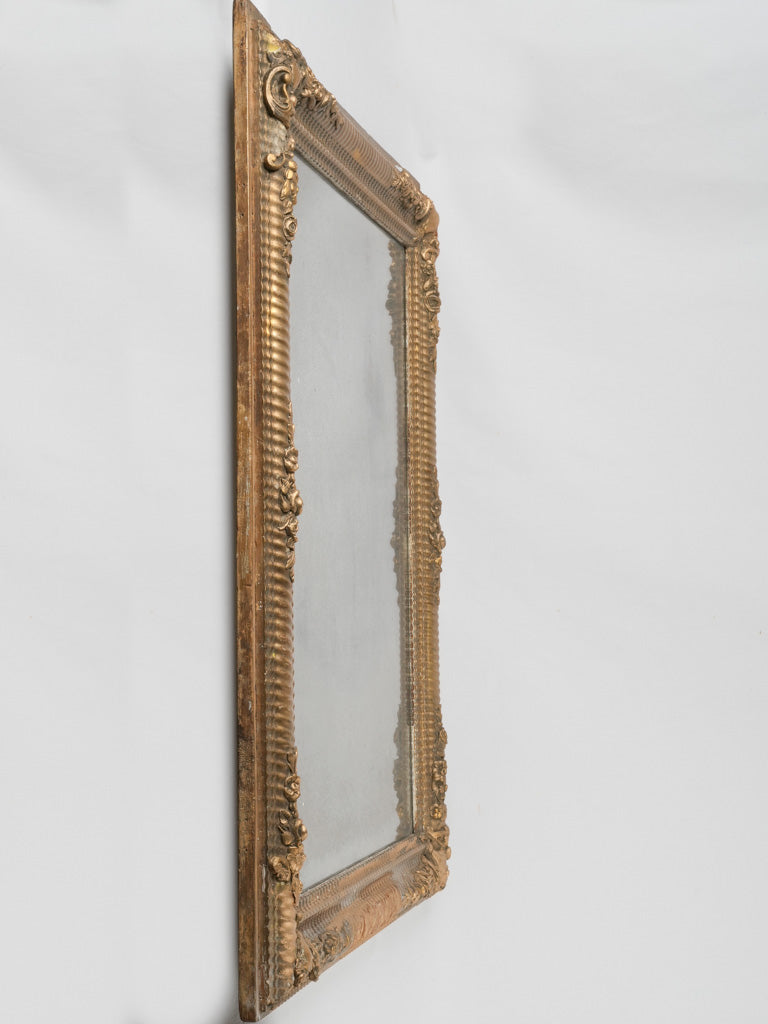 Old, ornate, gilded wooden mirror