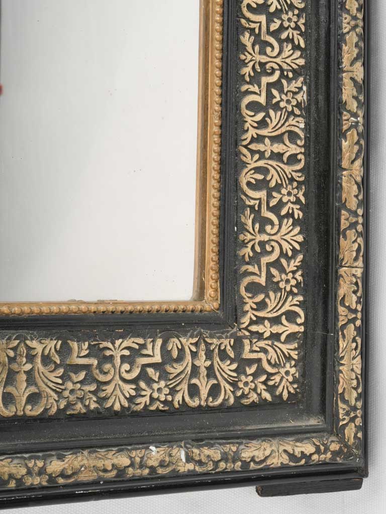 Ornate, aged wood frame mirror for interiors