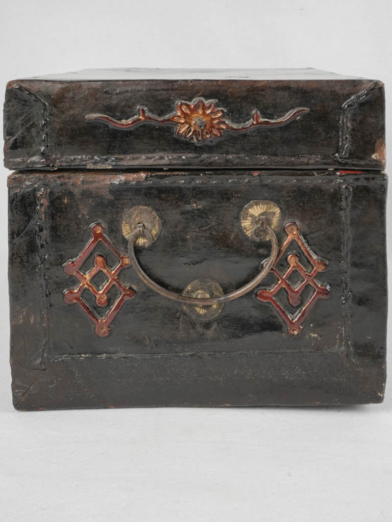 Ornate antique black leather coffer