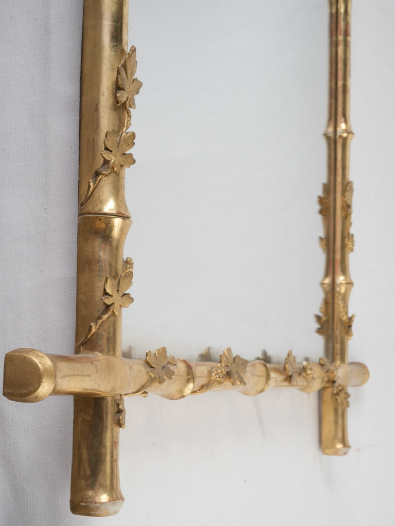 Elegant, gilded, ornamental wall mirror