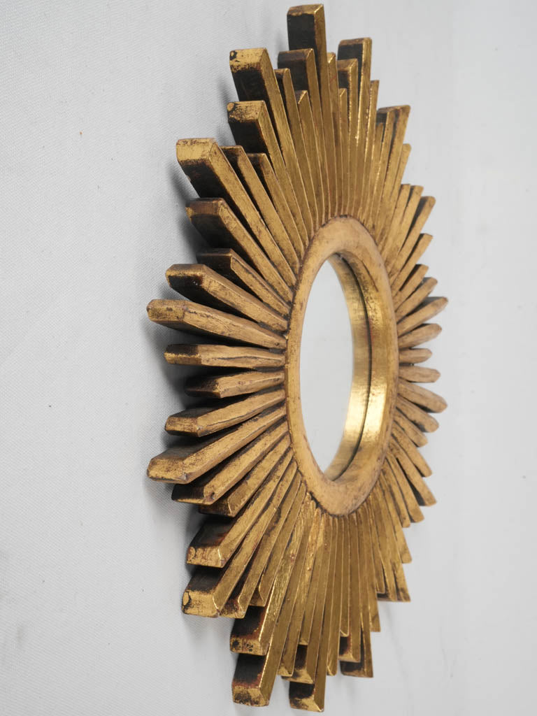 Charming small-scale gold mirror