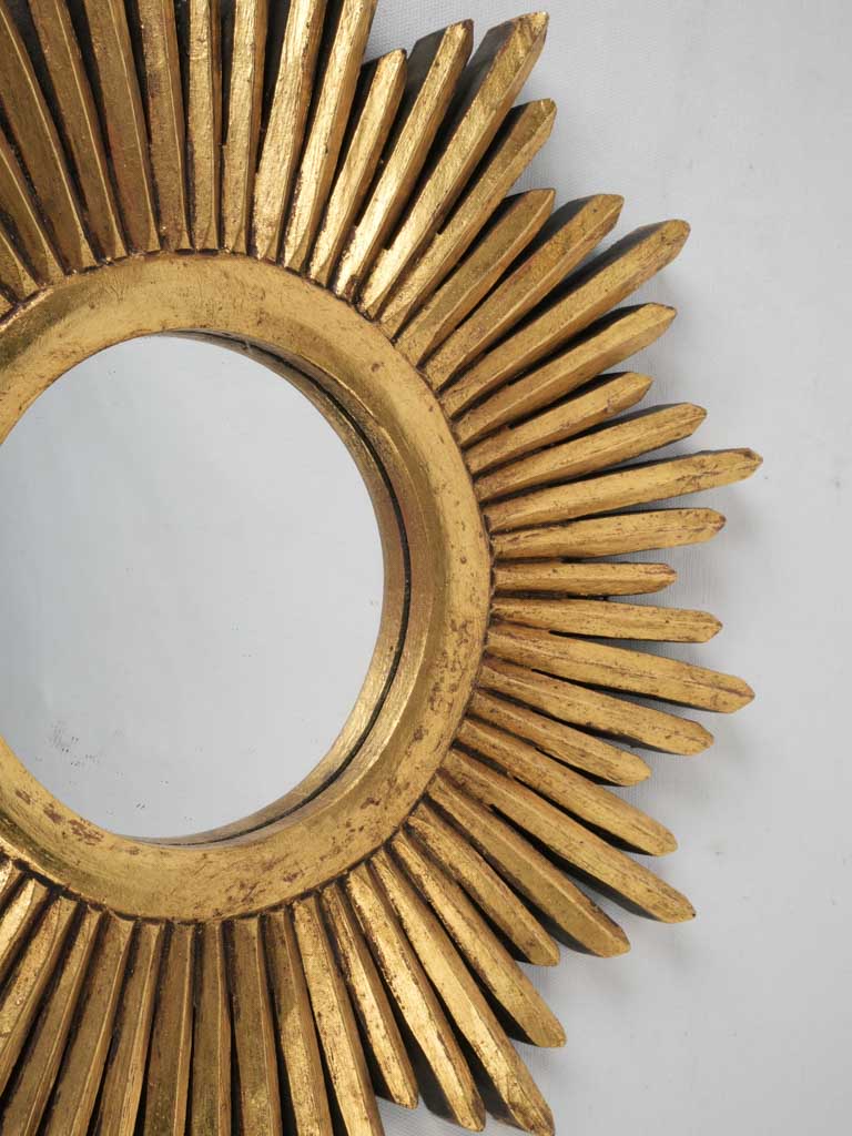 Elegant gold finish sunburst mirror