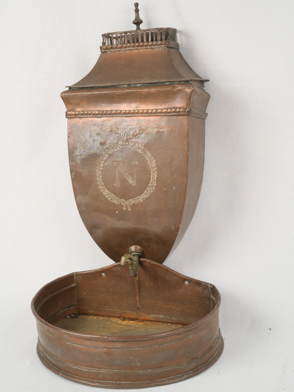 Aged copper wall-mounted fountain 