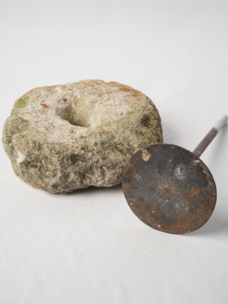 Rustic patina stone grinder art