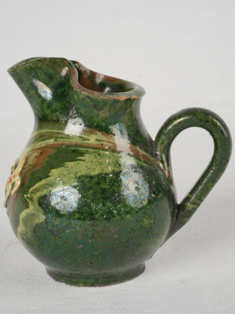 Distinctive green antique creamer