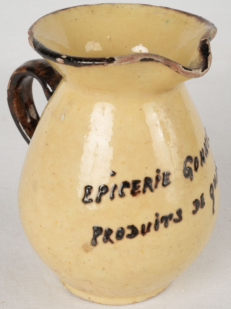 Vintage yellow-glazed advertising pitcher  