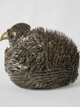 Polished, lifelike metal bird art