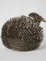 Imaginative, textured metal avian artwork