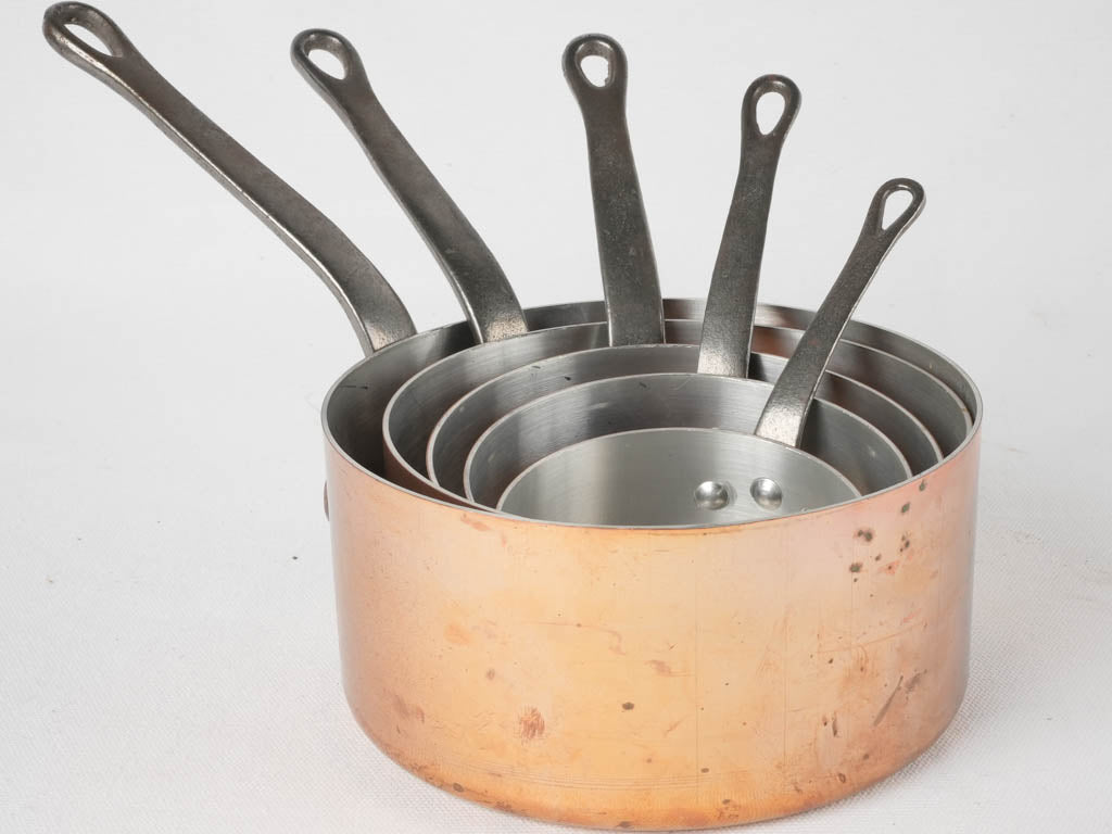 Charming nested copper saucepan set