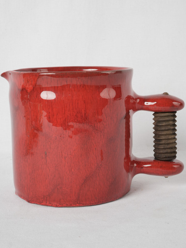 Innovative red glazed pottery water jug