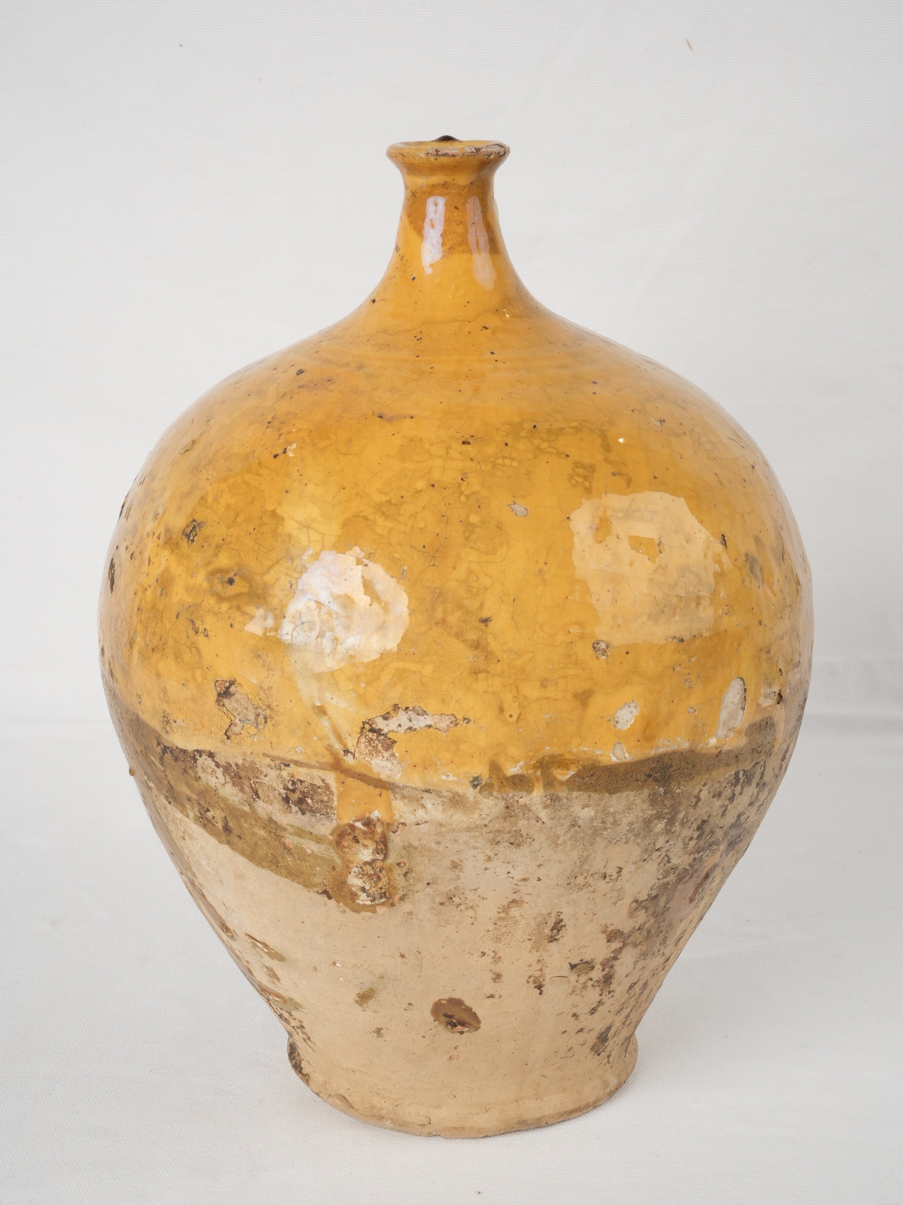 Vintage ocher glazed wine jug