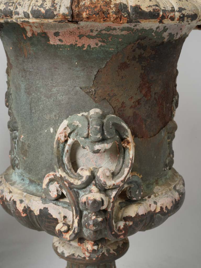 Stately Antique Sculpted Iron Urns