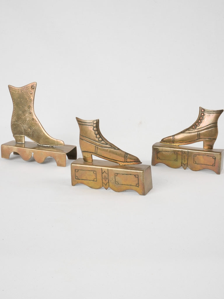 Vintage brass ornamental shoe displays