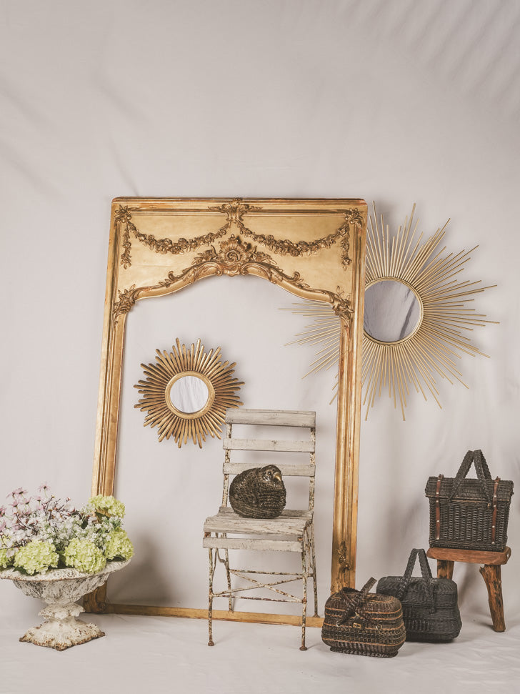 Aged wooden frame sunburst mirror