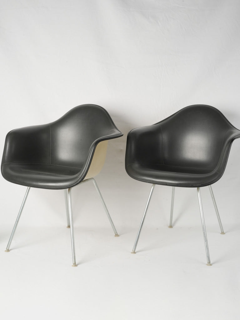 Sleek mid-century Eames armchairs